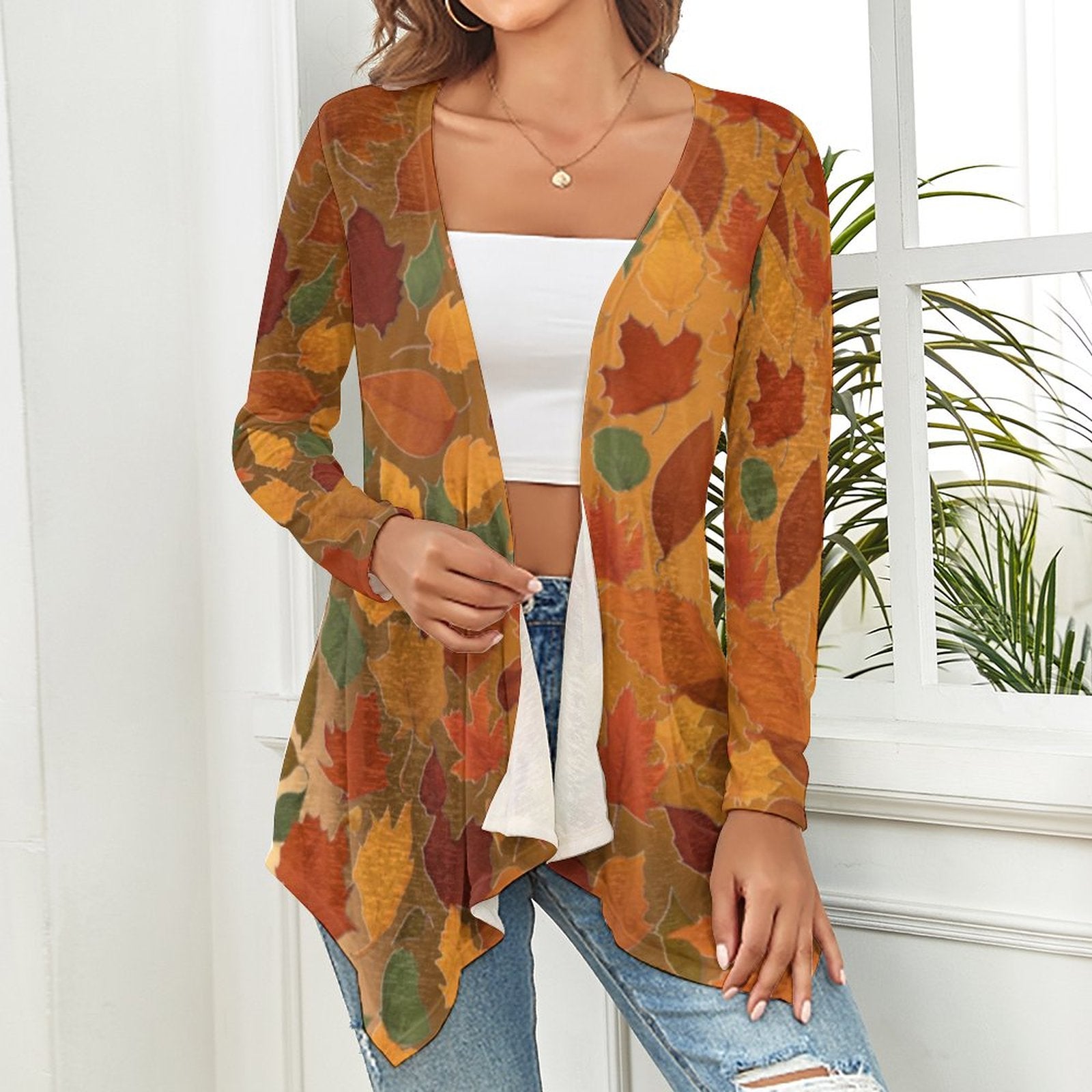 Woman wearing a colorful autumn-themed cardigan indoors. - PrintPrintspirationz