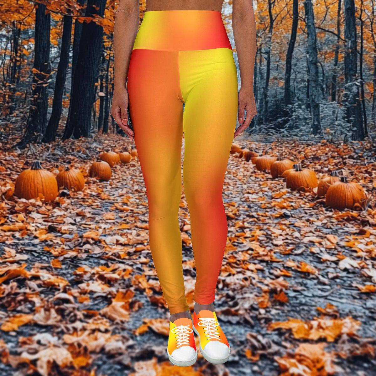 Woman in Vibrant Gradient Warm Colors High Waist Yoga Leggings  with matching shoes in a forest with pumpkins. - Printspirationz