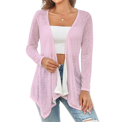 Woman wearing a pink cardigan over a white top and blue jeans on a white background -Printspirationz